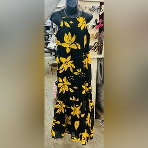 Black and gold Maxi dress. Spaghetti strap with tie in the back around the neck.
